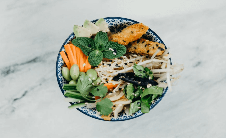 Fresh meal ingredients and colourful prepared food